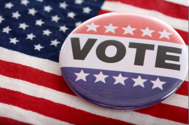 Image of a Vote Button Pin on the American Flag